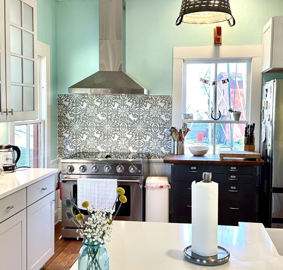 Kitchen is fully stocked with dishes, cooking supplies, spices, etc. 