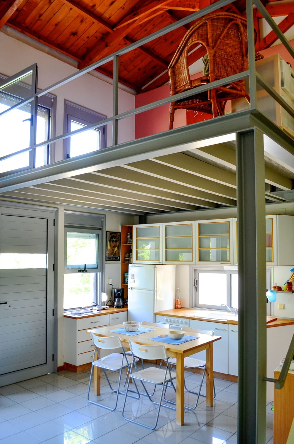 Entrance with kitchen and sleeping platform above