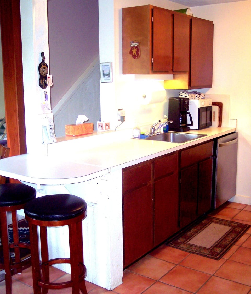 Kitchen with counter seats.