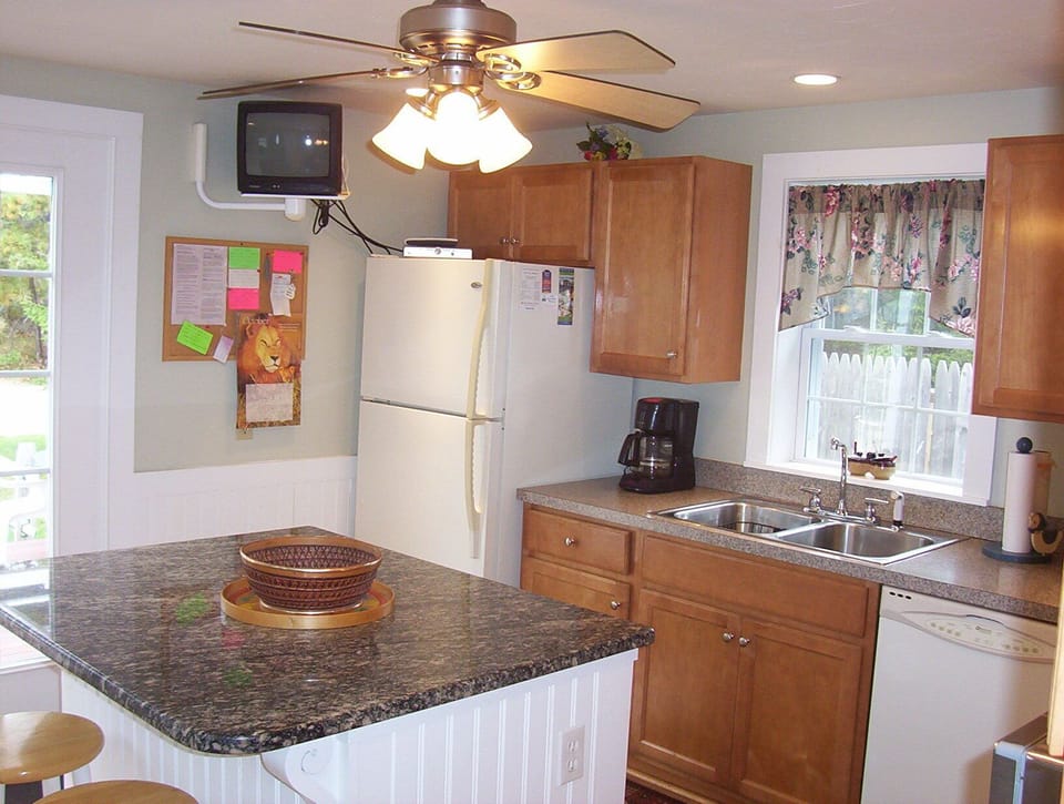 Granite Center Island With Wall T.V.