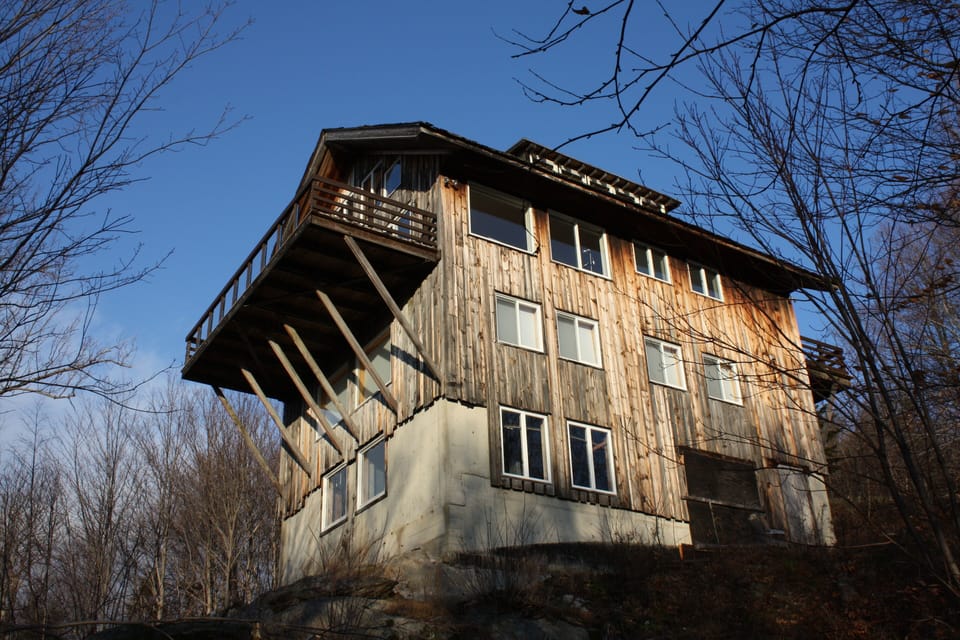 House from below in the woods