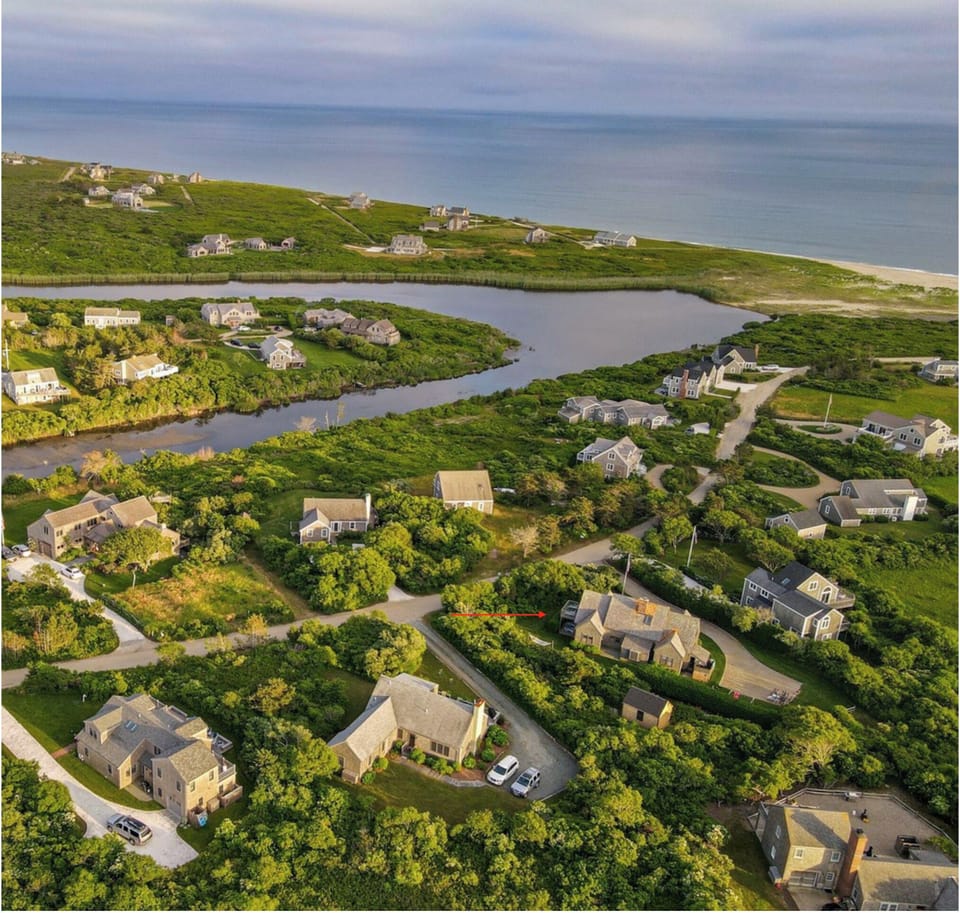 Arial view of the house (rear) and the nice neighborhood. See the red arrow!