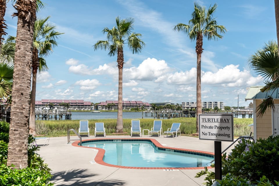 Community pool with access to fishing dock.