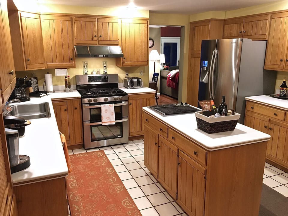 Large kitchen with stainless steel appliances and plenty of cupboard space