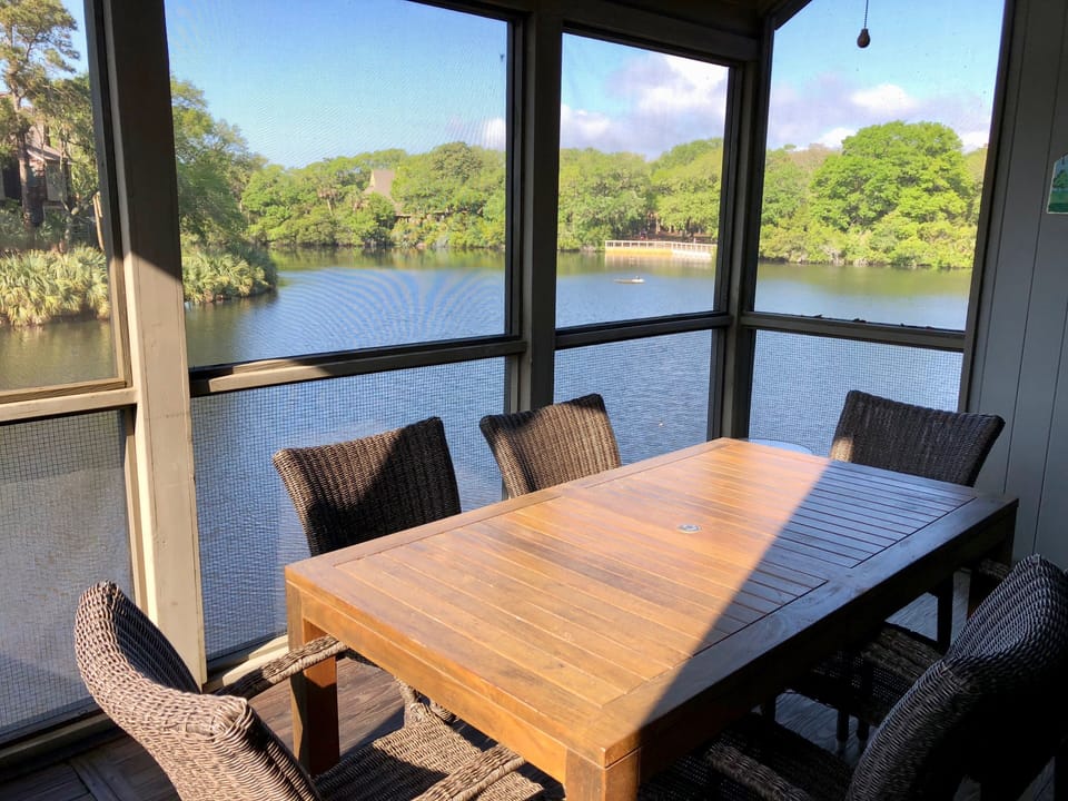Screened porch with panoramic view of lagoon
