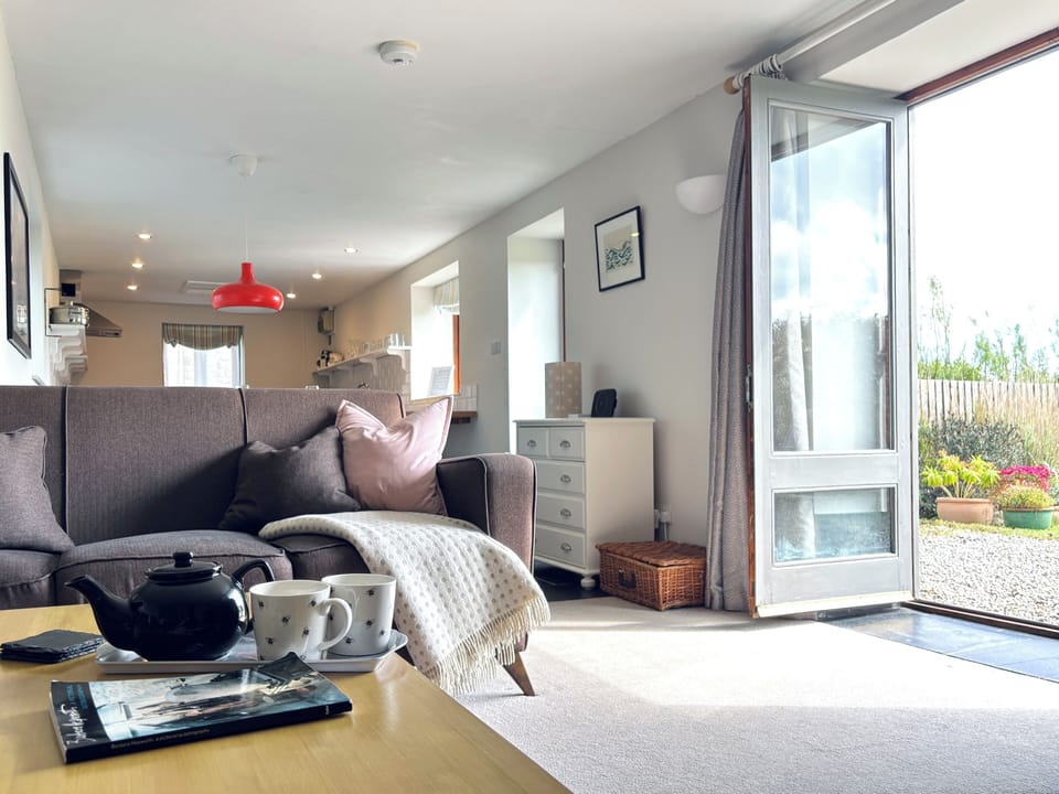 Bright, comfortable living room for relaxing after coastal days.