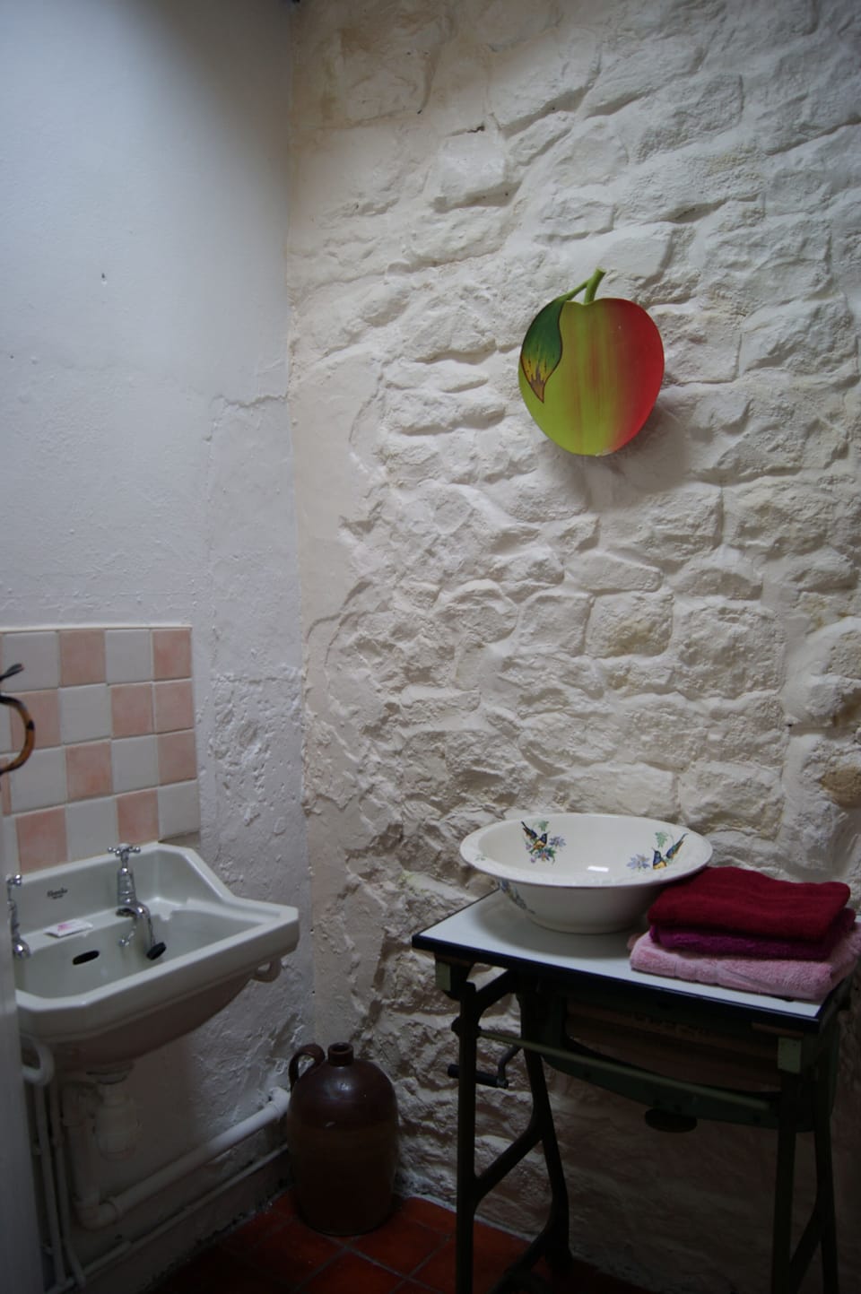 stone bright shower room with sink, toilet and shower cubicle.