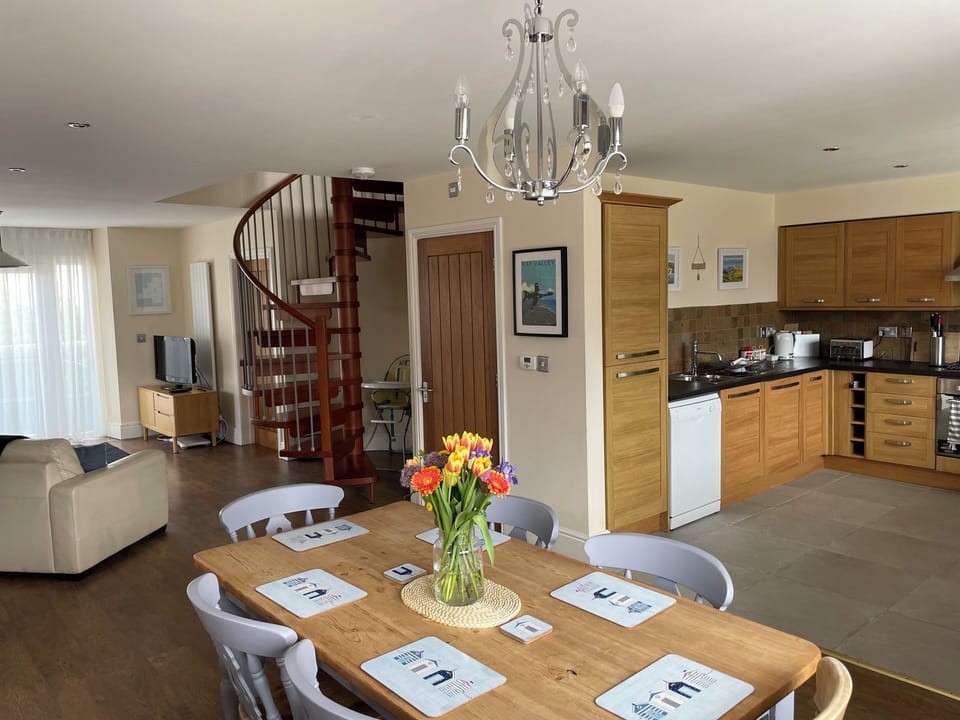Open plan kitchen, lounge and dining room.