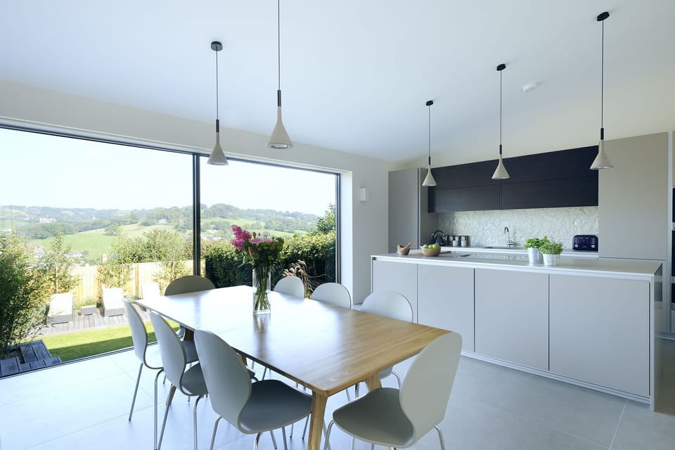 The bright kitchen and dining room are spacious and modern