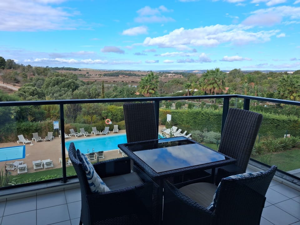 Balcony with views over the pool and the estuary. Enjoy the sunset .