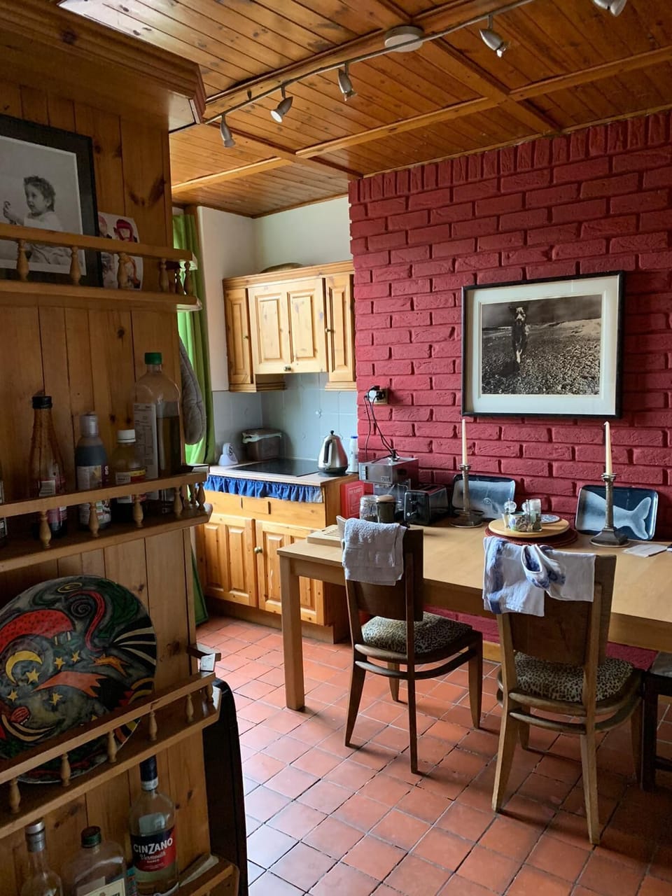 Looking across kitchen to table and ceramic hob in corner