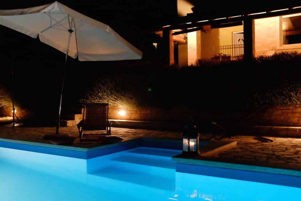 pool and house at night