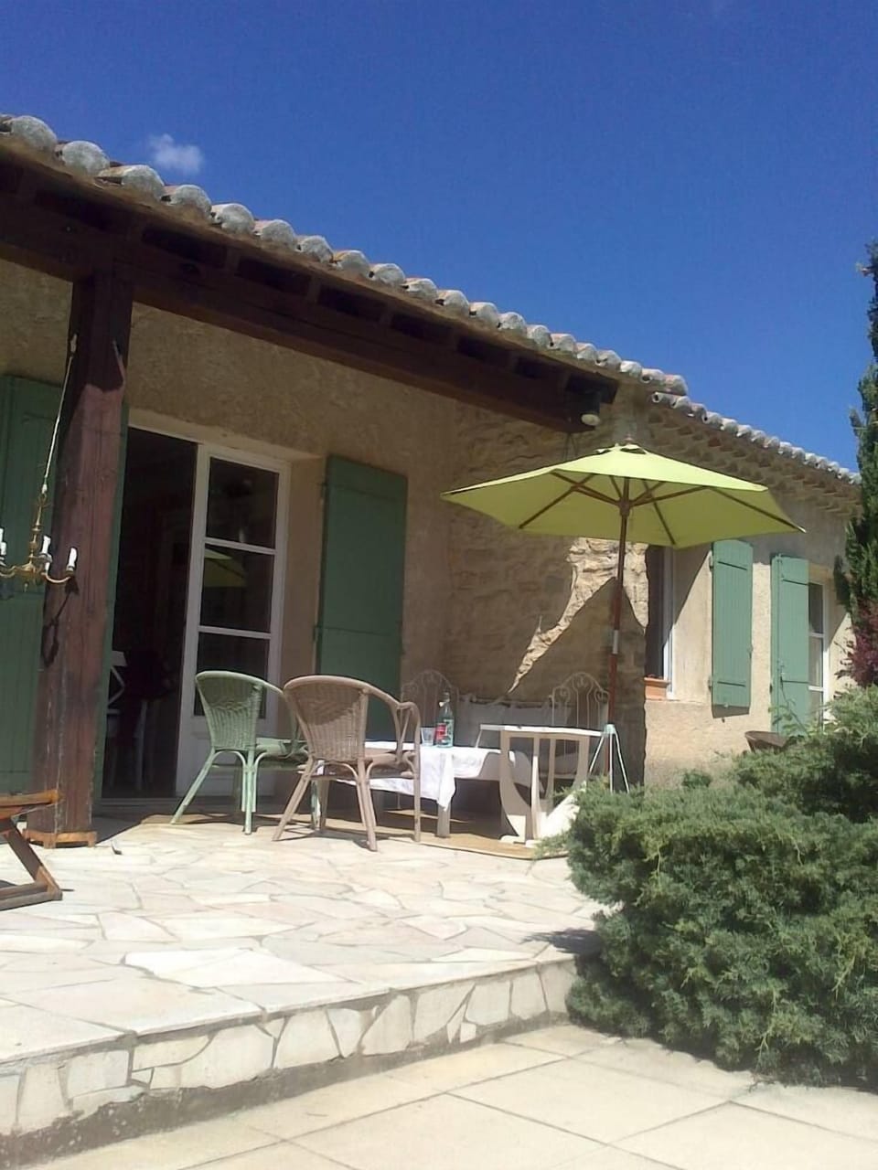Terrace and French window of the living-roomn from the pool.