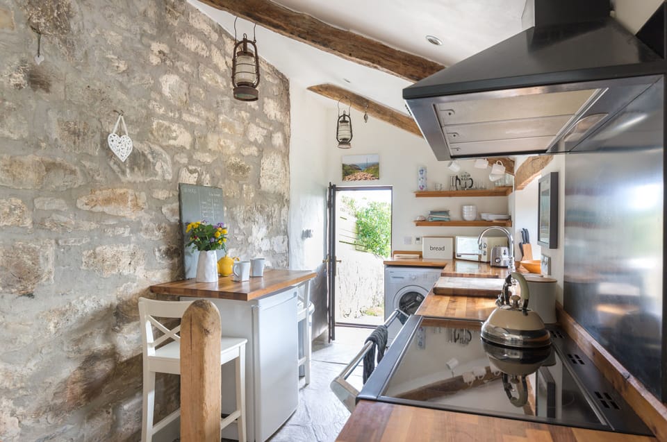 Galley style kitchen with heating under the traditional slate floor.
