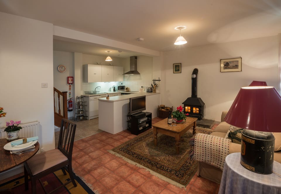 The cosy living space complete with roaring wood-burner.