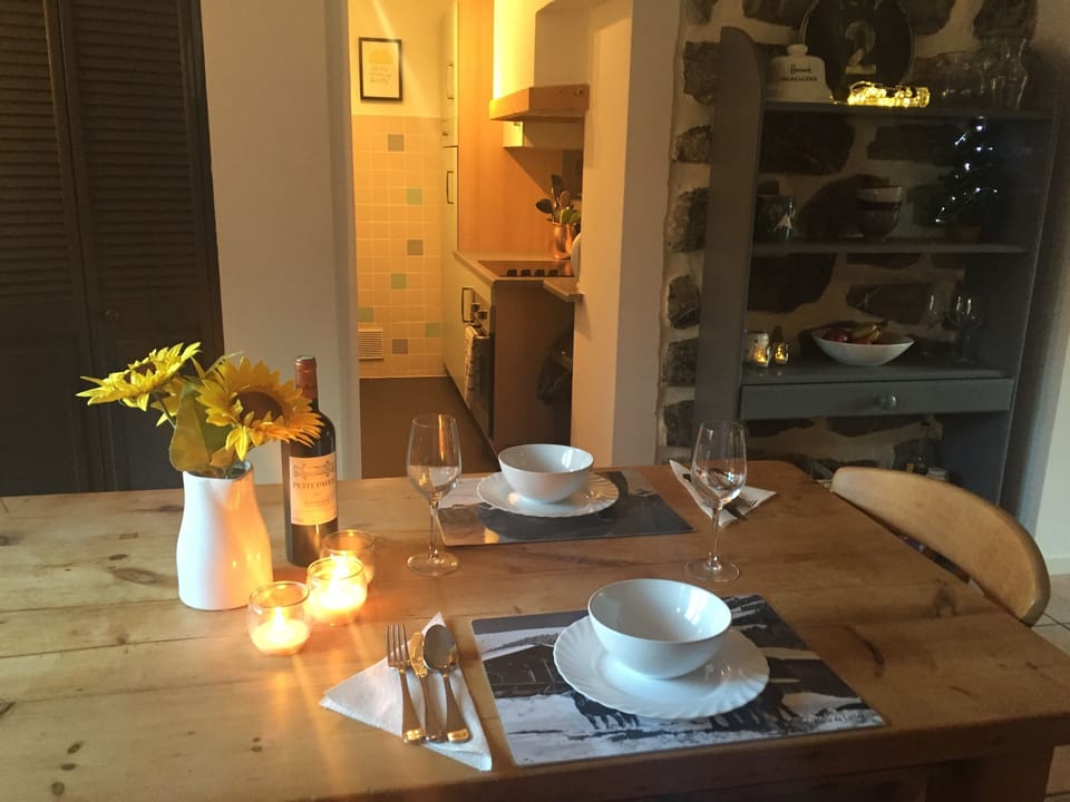 Dining area with kitchen beyond