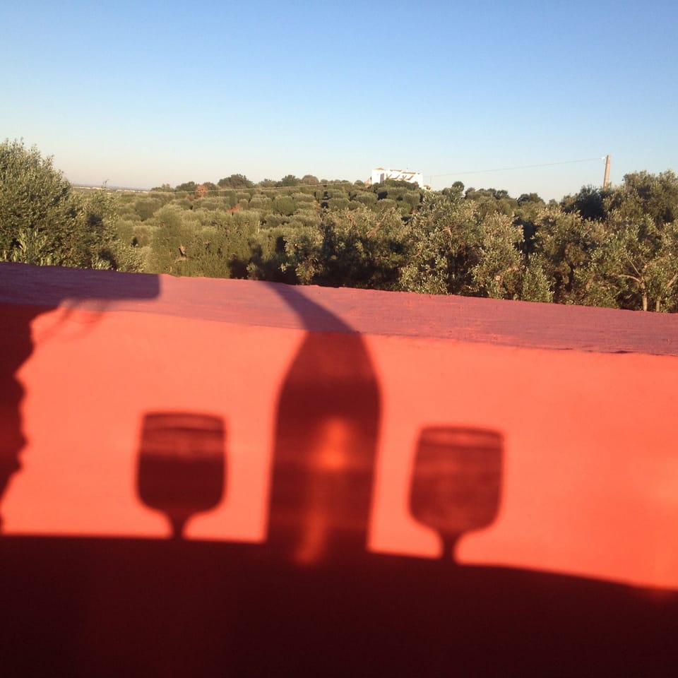 Bellavista sundowner on roof top bar with view to neighbouring hilltop masseria