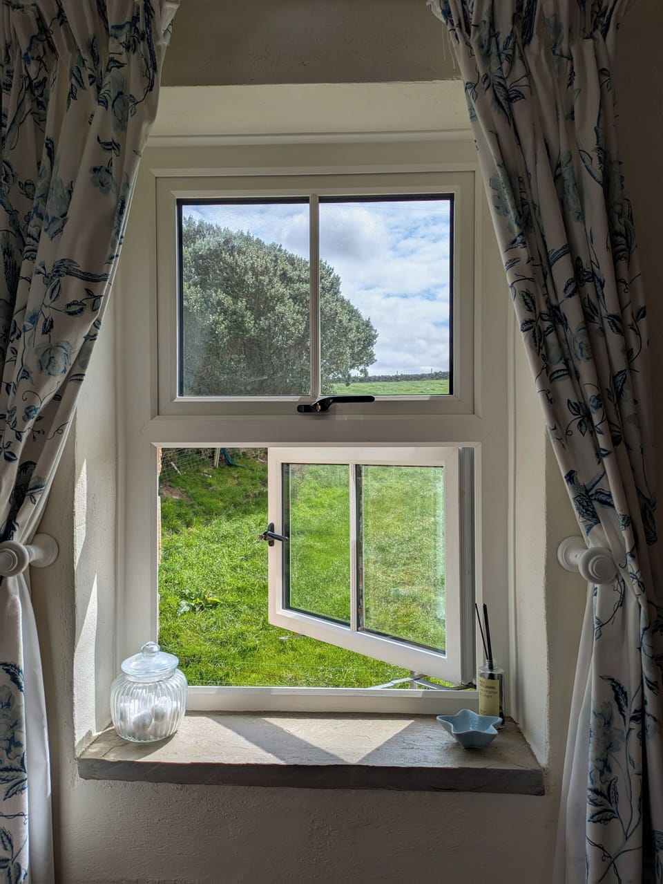 Overlooking farmland at the side of the cottage