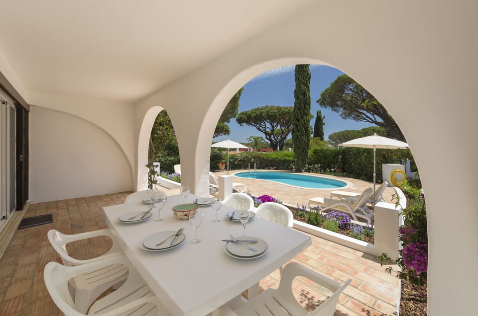 Veranda overlooking pool for outdoor dining
