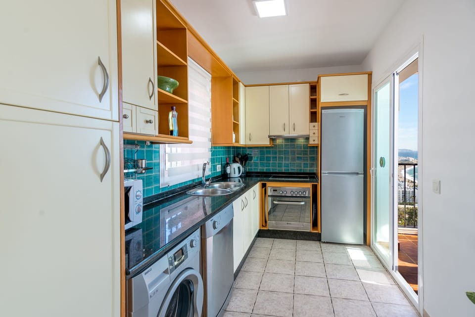 Kitchen with washing machine and dish washer