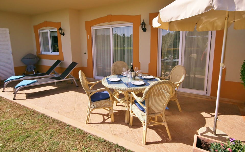 Spacious rear patio to dine out, and a BBQ too.