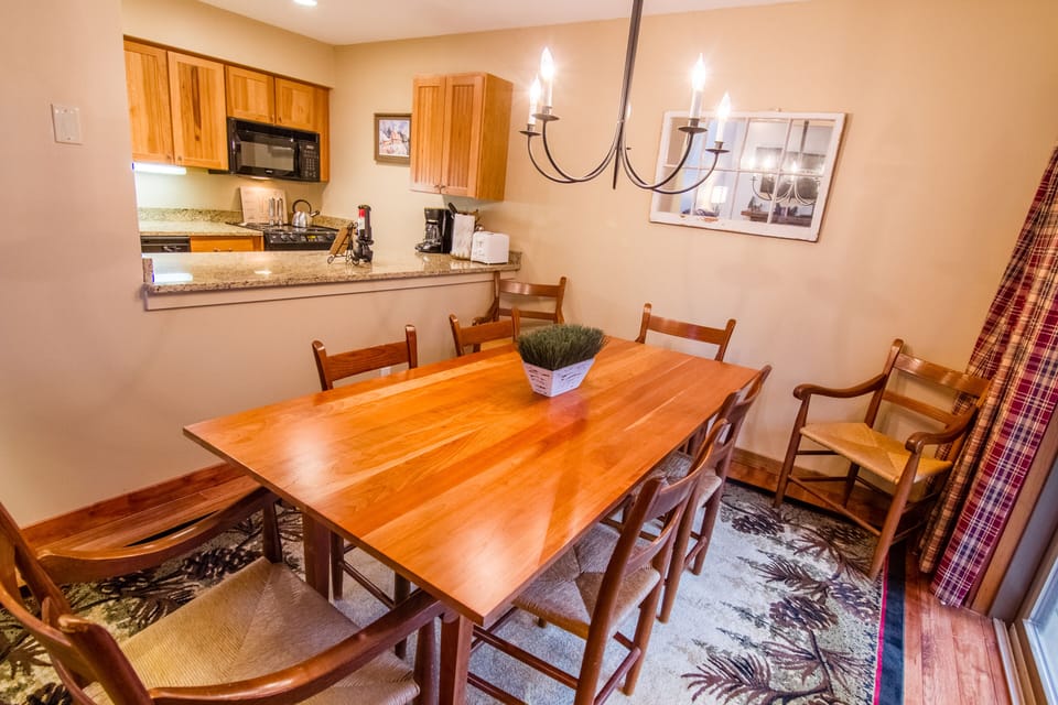 Dining room view into open kitchen. 