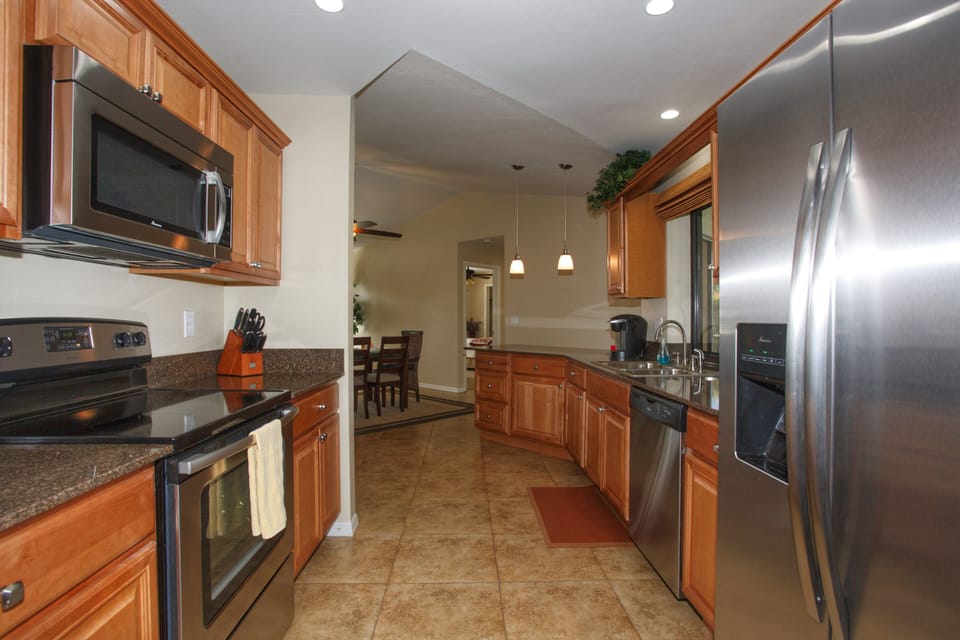 Kitchen with High End Appliances and many amenities to enjoy meals at home.