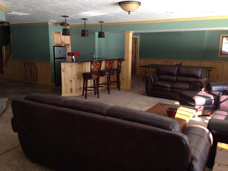 Very spacious lower level with bar, stone fireplace, sauna, game room, bunk room