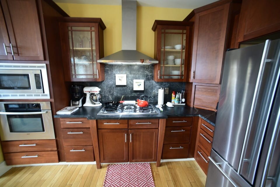 Gas range, microwave, oven, coffee nook (out of view), large frig/freezer
