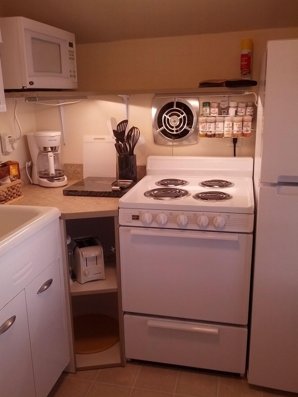 custom corner cabinet with storage. new microwave, coffee maker, stove 