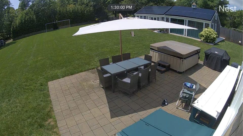 Patio with large Cantilever Umbrella, dining set, hot tub and Large Weber grill
