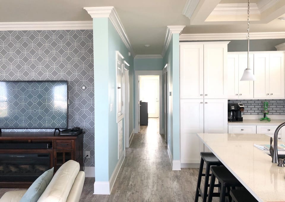 4/16. Hallway to 1st floor master, bunk room, laundry room, and bathroom. 