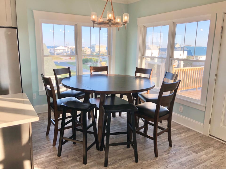5/7 Dining area. Table can expand to round.  Add in some bar stools from island.