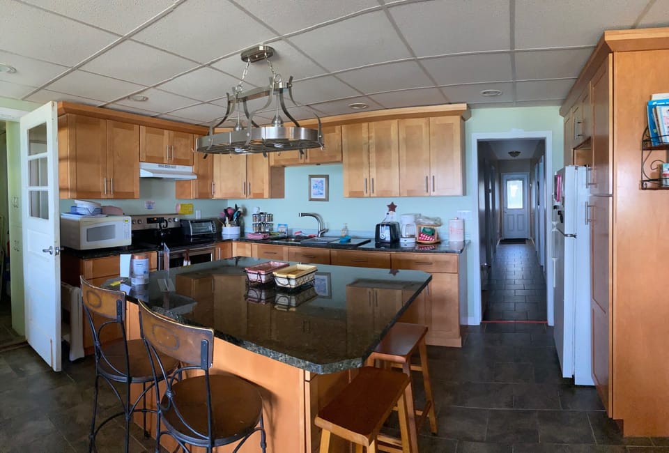 full kitchen, stainless steel appliances including dishwasher. Island seats 4.
