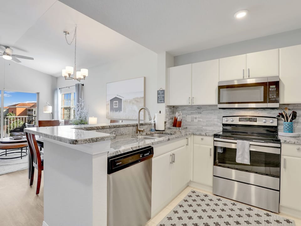 Granite countertops, newer appliances and fabulous servingware makes cooking fun