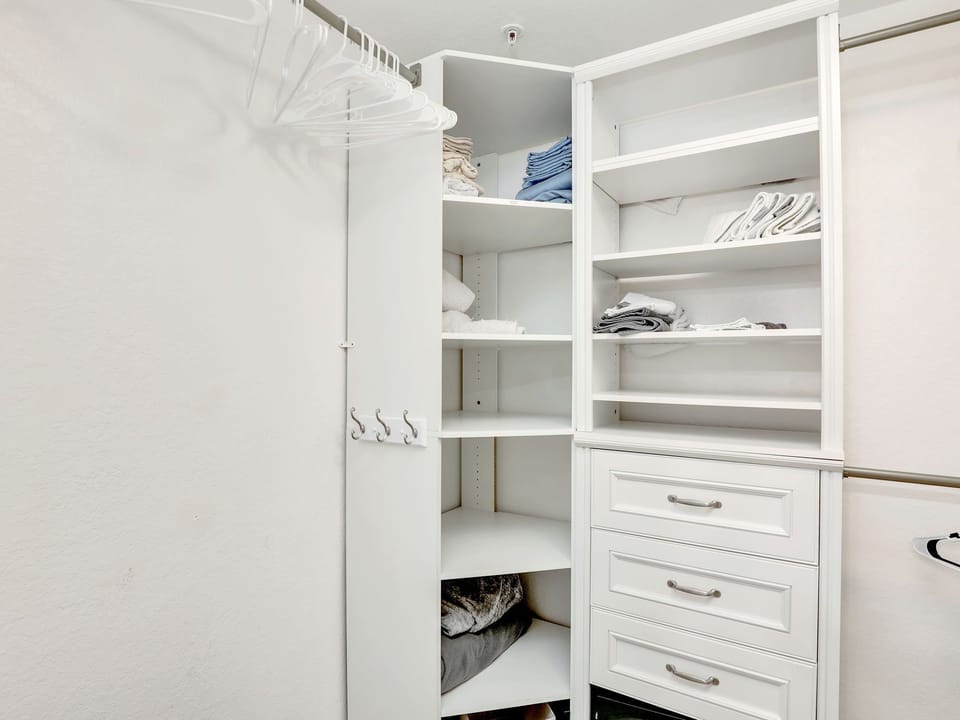 Large walk-in closet in Master with anchored combination SAFE.