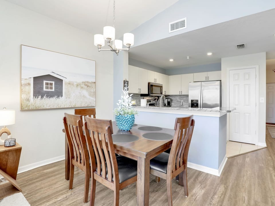 Dining table has four chairs and one bench for seating 6. Easy to clean.