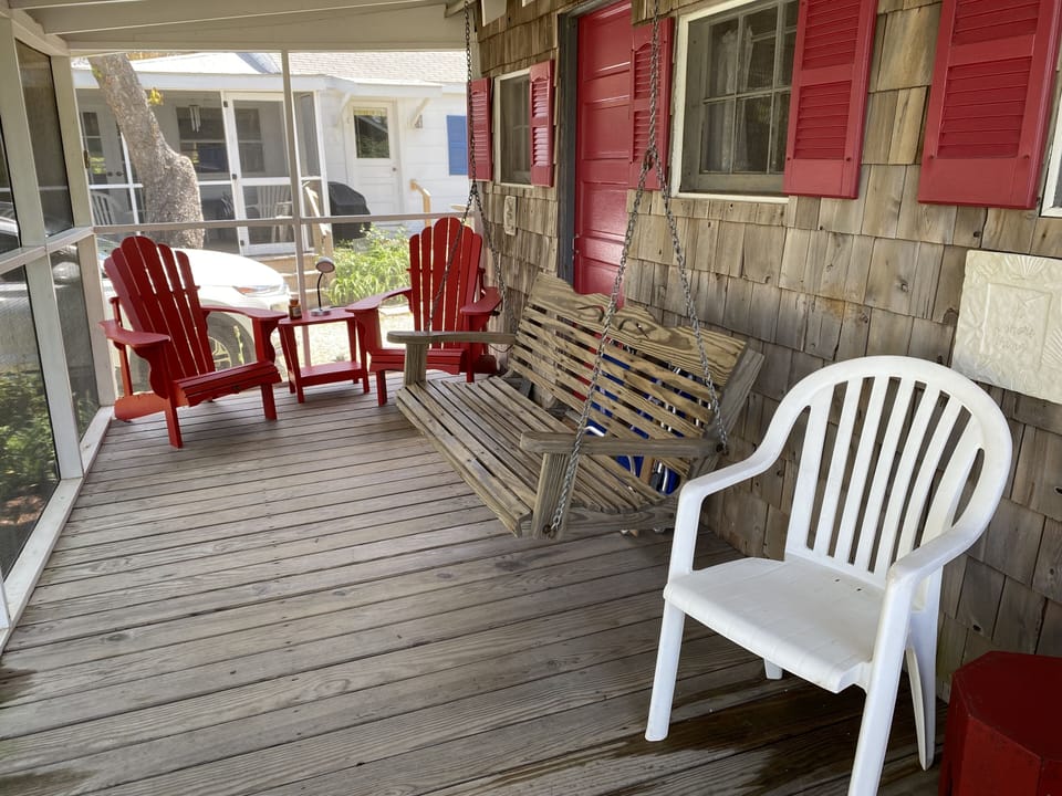 The porch faces the bay, and the swing is a great place to relax.