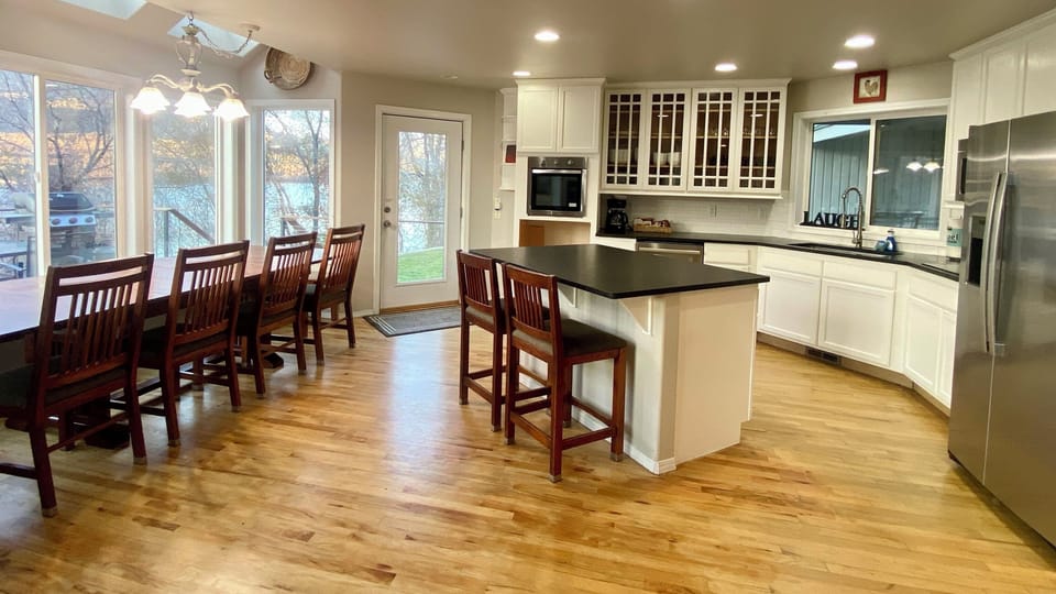 Open kitchen and dining area with bonus island seating in the main house