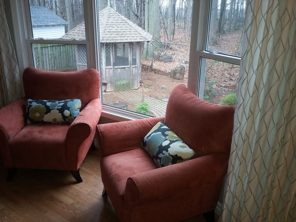 SITTING AREA IN DINING ROOM, OVERLOOKING GARDEN AND FOREST