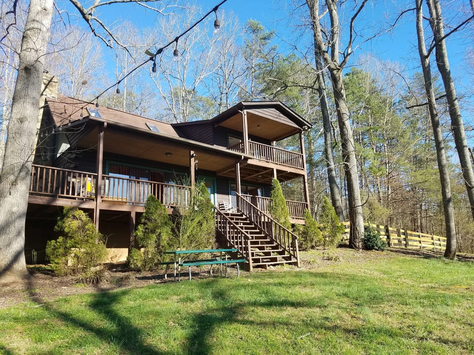 spacious log cabin on 3+ acres with river access on property
