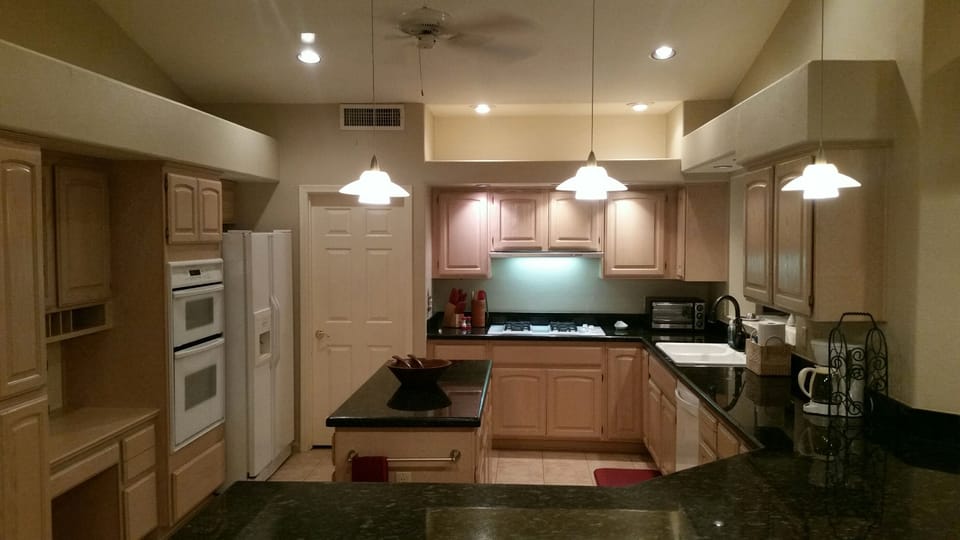 Spacious kitchen with granite and an island