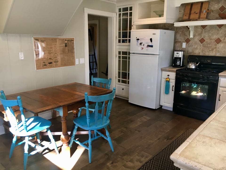 Dining table. Fits 4 comfortably and extends to fit 5 comfortably.