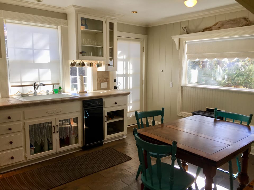 Kitchen leads to the backyard/deck.