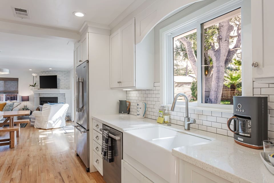 Kitchen window/sink with views out to the backyard