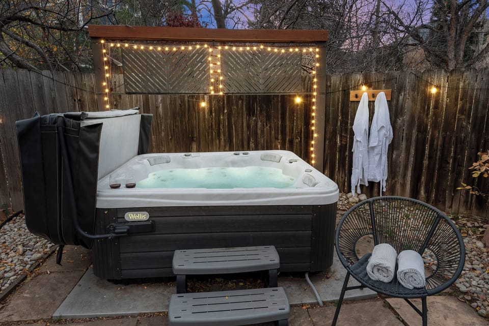 Hot Tub Oasis: Indulge in bubbly bliss under twinkling lights and serene views!