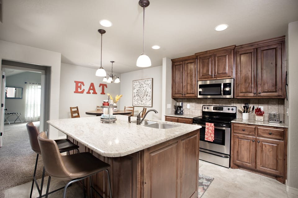 Stove, microwave, dishwasher, refrigerator and all the essentials to cook a meal