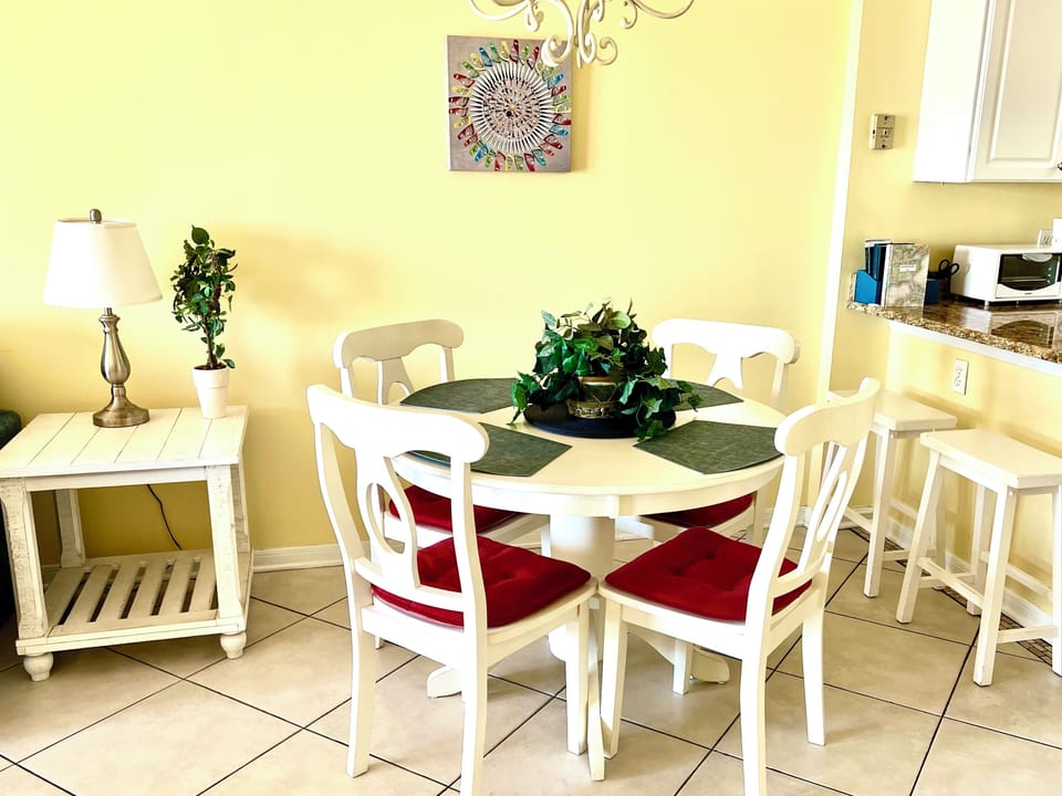 Eating area with counter stools seats 6...