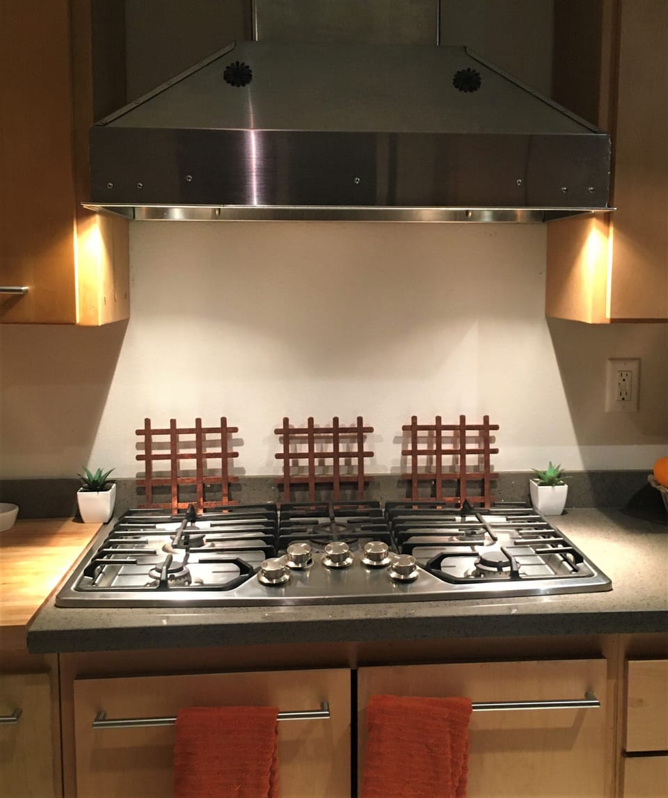 Kitchen  5 Burner Electrolux gas stovetop
lot of quality pots & pans and knife