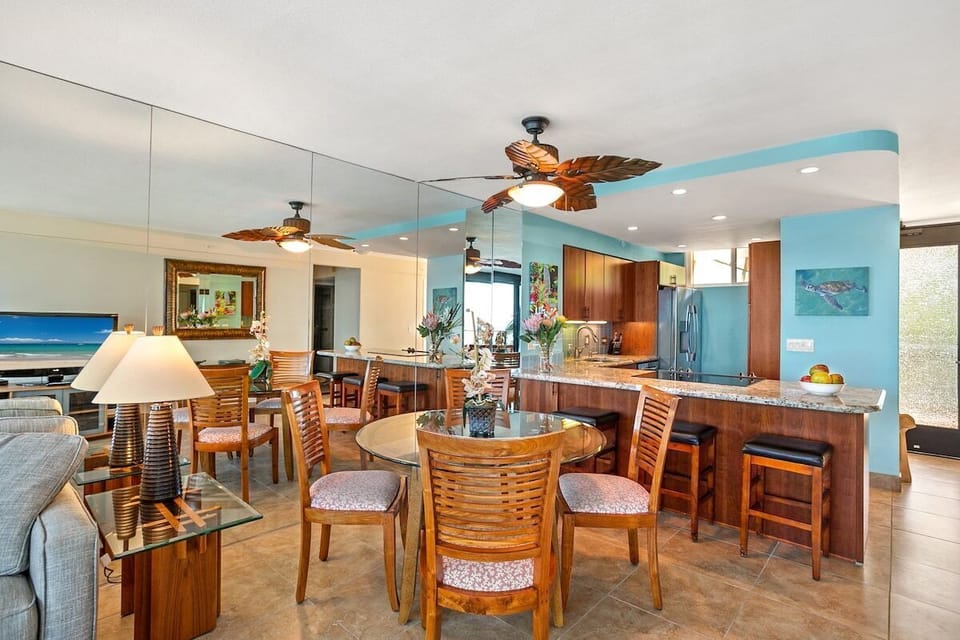 Cozy dining space with tropical décor and easy access to the kitchen for a seamless experience.